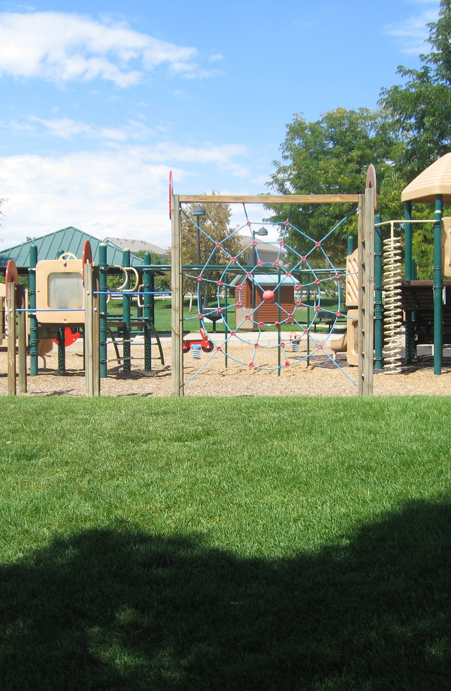 Outdoor playground equipment in a grassy setting